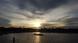 Sun setting off with the boat in the Netherlands